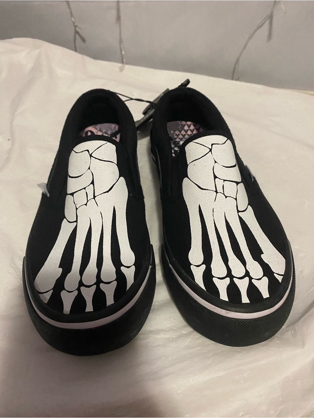 Airwalk Kids Black Slip-On Sneakers with White Skeleton Foot Print